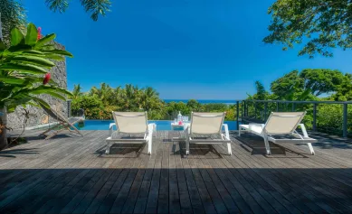 An infinity pool with lagoon views