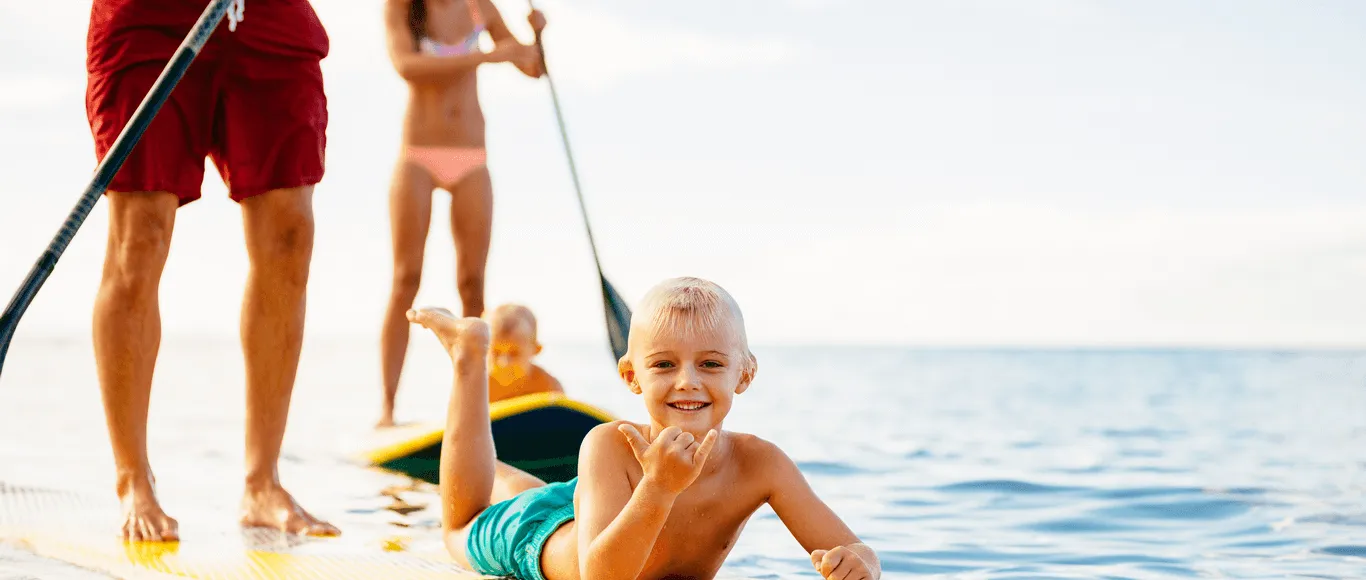 Family paddle boarding on the lagoon