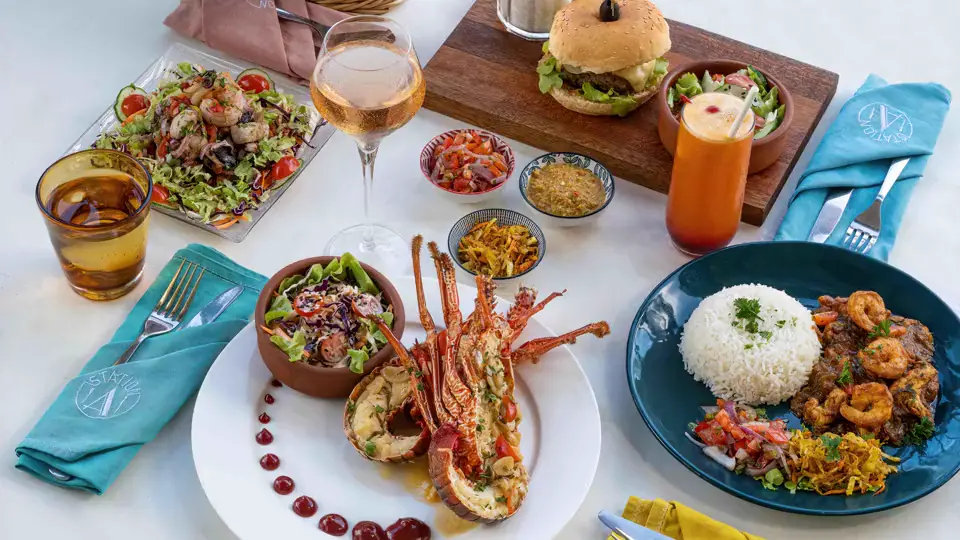 Grilled lobster, burger, prawns and rice